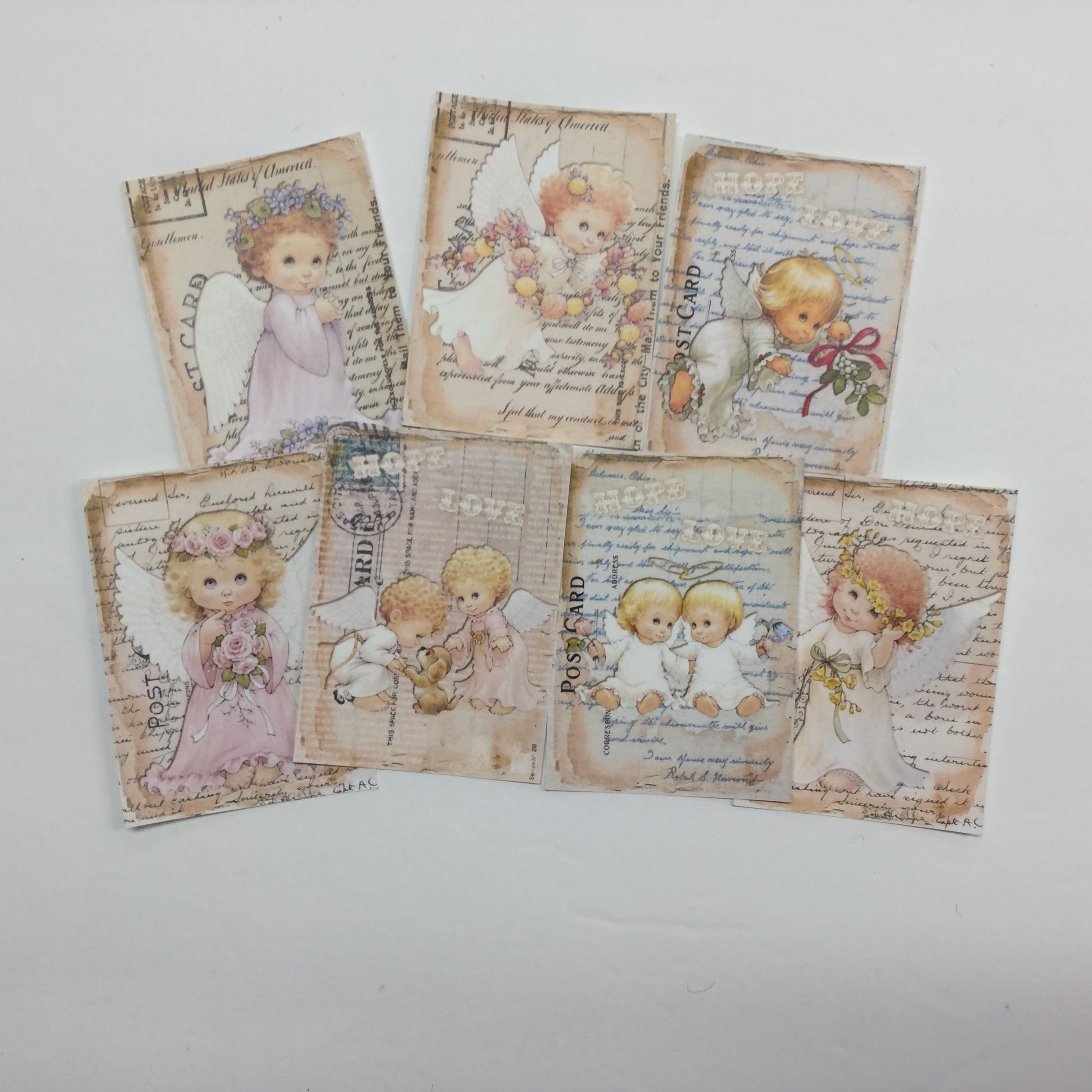 7A413D3A-960F-471D-8359-C49EADE654B0.jpg Tags & Ephemera 7pc VINTAGE FLORAL BABY ANGELS - Image 1
