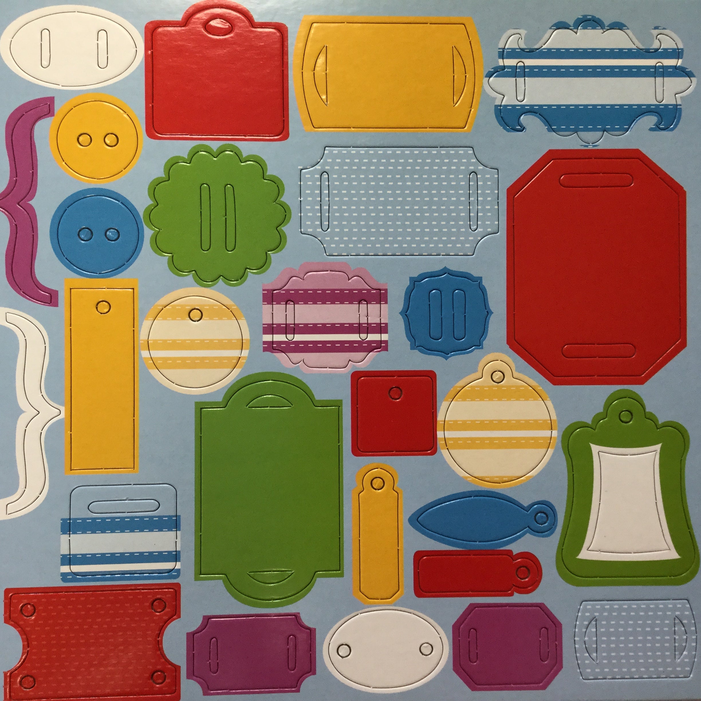 7DF6FC45-4925-4B0F-9491-0520E4A28561.jpg Primary Chipboard Charm Brackets & Labels 12” x 12” Sheet - Image 1