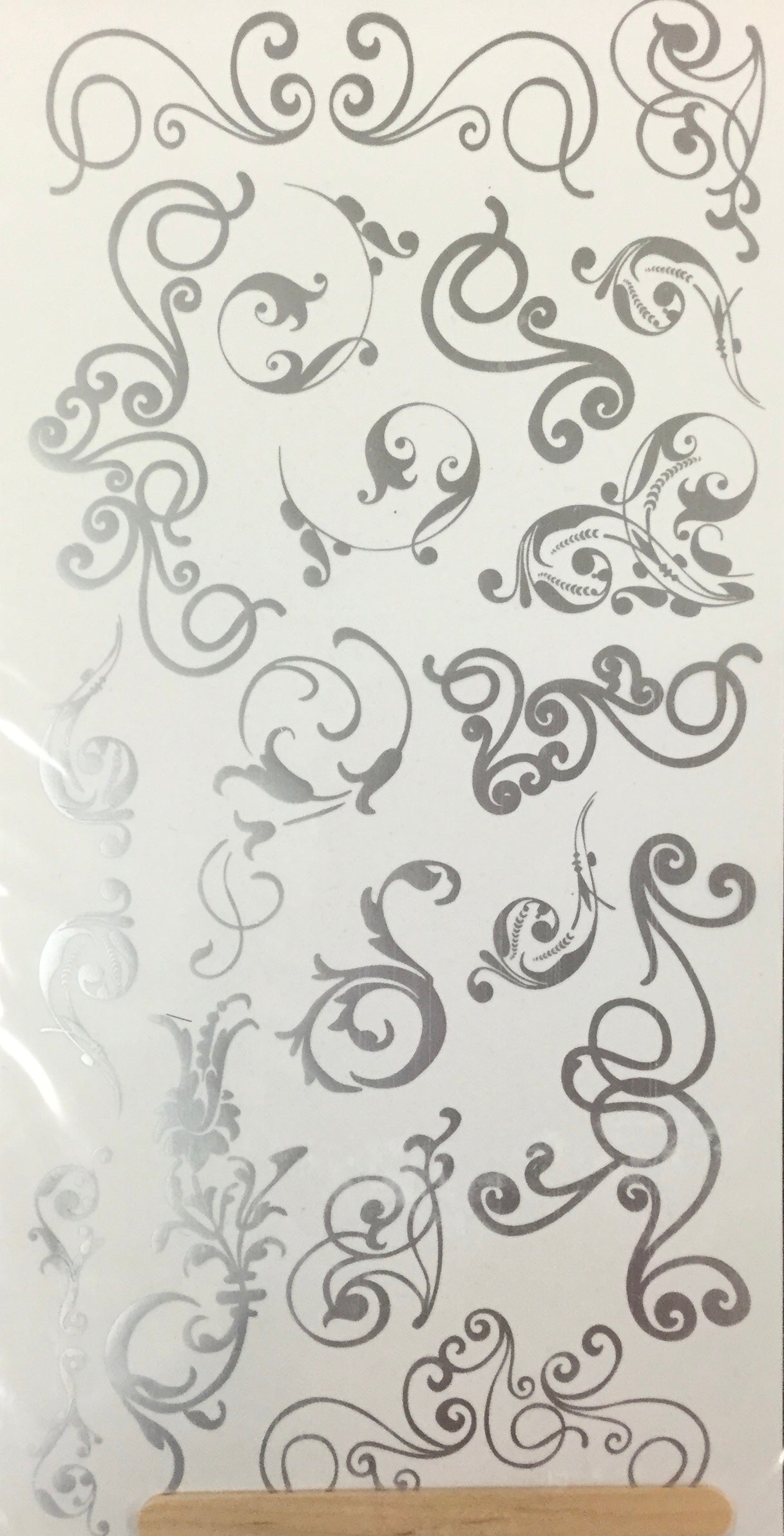 B2D4CCCA-037E-4963-8BA5-3CA799349FA7.jpg We R Memory Keepers Precious Metal SILVER LINING SWIRL Rubons - Image 1