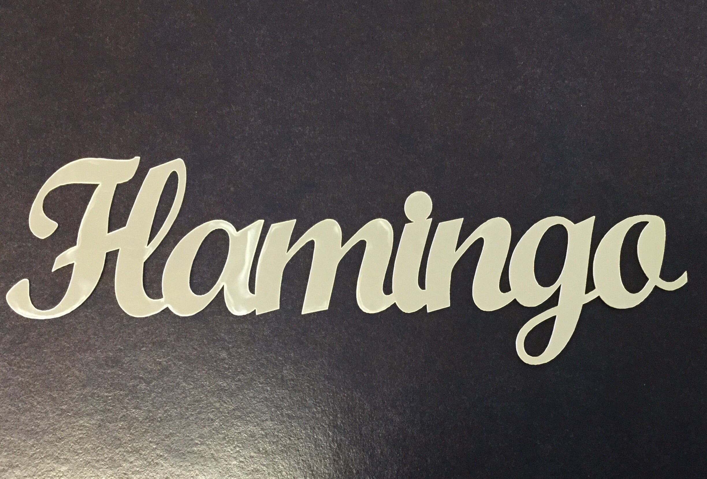 image_00456c50-7d41-4936-b3ea-f52ae6413736.jpg FLAMINGO Silver Title Travel Laser Cuts 3"X9" 1pc - Image 1