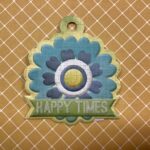 WeR HAPPY TIMES Embossed Diecut Charm
